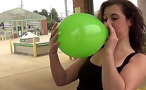 Fifi Foxx Blows and Pops Balloons Outdoors