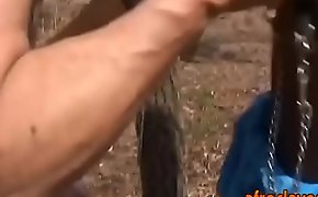 African slave gives master blowjob outdoors