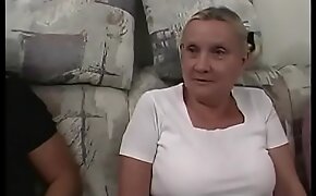 Busty grandma looks slightly ridiculous in her tight top and short mini skirt, but there is no doubt that she is damn good in bed