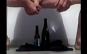 A man really loves beer and wine  Changing bottles