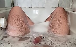 24 year old in the bathtub playing with her feet and cock