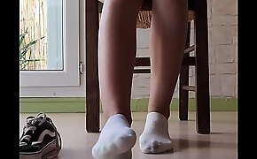 Candid girl feet in white socks