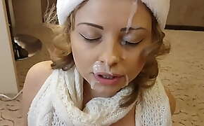 Christmas blowjob with a massive cumshot on her beautiful face