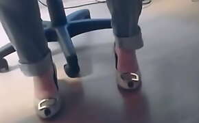 Heels under desk coworker 1