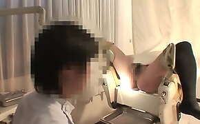Peeking at the medical examination of a pregnant woman with a large areola and stomach