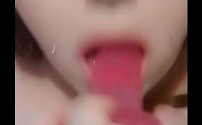 Trans girl fucks throat with toy