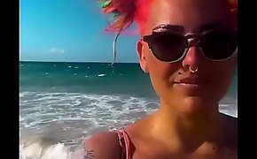 Natalie Casanova walks around the beach exposing her massive tits