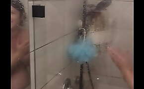 My pregnant wife in the shower and singing