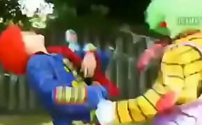 Clown fighting while sucking clown dick