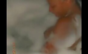 Sylvia Mukila shows off boobs in tub